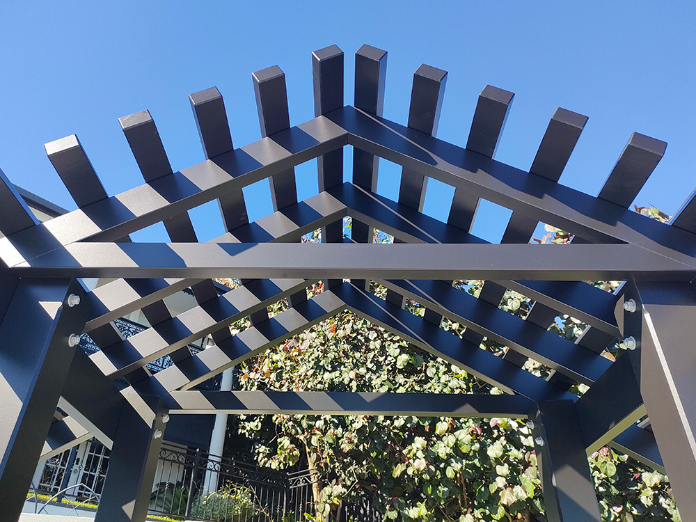 Premium painting in gloss black the Pine Entrance Arbour looks flawless from under the entrance way.