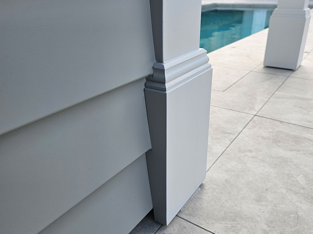 While this finish may look simple it is actually quite intricate. The decorative post boxes have been carefully cut so that the cladding fits seamlessly and it provides a professional finish for the bottom of the wall.
