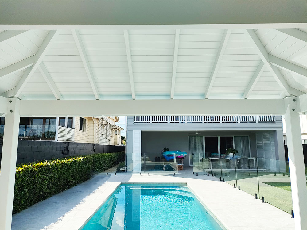The beautiful view from the Pool Cabana looking towards the house, showcasing the flawless VJ Ceiling.
