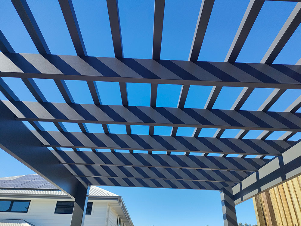 The view from under the Pine Timber Pergola painted in Monument. We focus on each detail and provide a high-quality product each and every time.