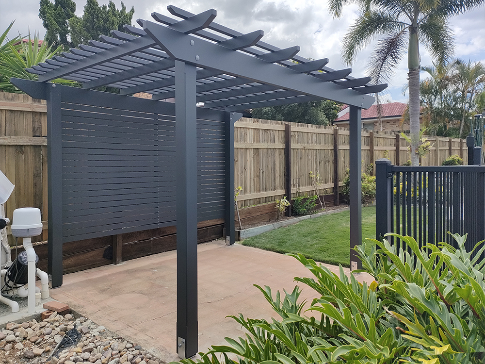 This Pergola Kit has been customized to adjust the size slightly, painted in Monument, add back screening and includes installation.