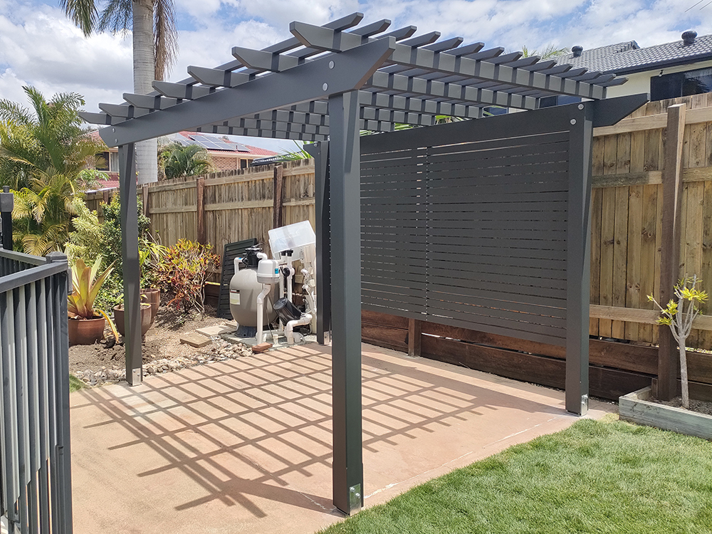 This Pergola Kit has been customized to adjust the size slightly, painted in Monument, add back screening and includes installation.