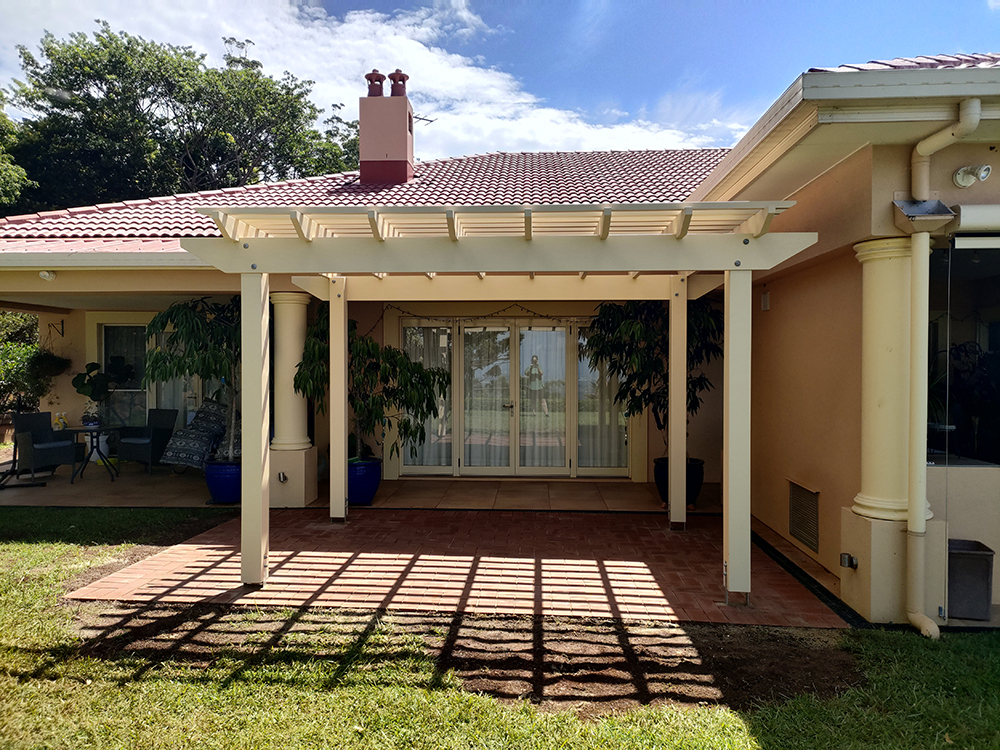 Stunning new Pergola centered in front of the sliding glass doors.