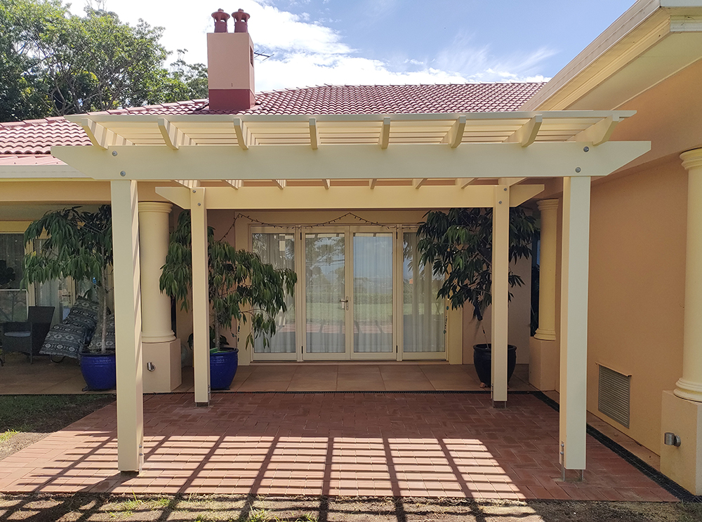 Stunning new Pergola centered in front of the sliding glass doors.