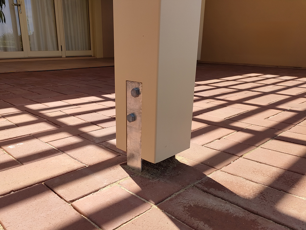 Concrete Anchor Brackets that have been fully installed and brick paving relaid for a nice and tidy finish.