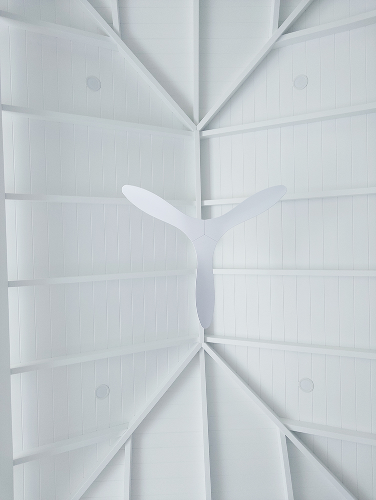 Pool Cabana with a beautiful seamless white VJ ceiling, lighting and a ceiling fan.