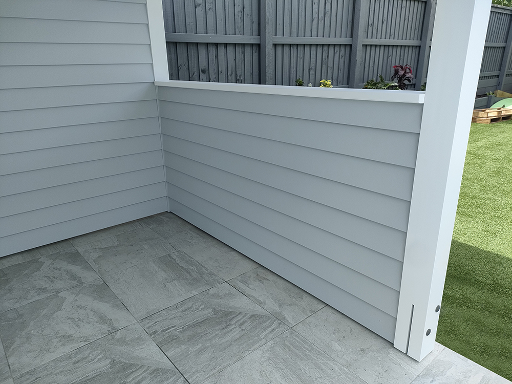 Pool Cabana with half wall with Hardie Linea cladding featuring a flawless finish.