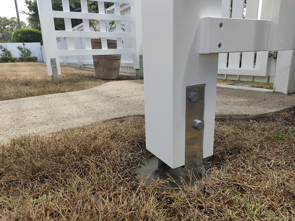 H3 Treated Pine Posts concreted in the ground with High Wind Concrete Anchor Brackets