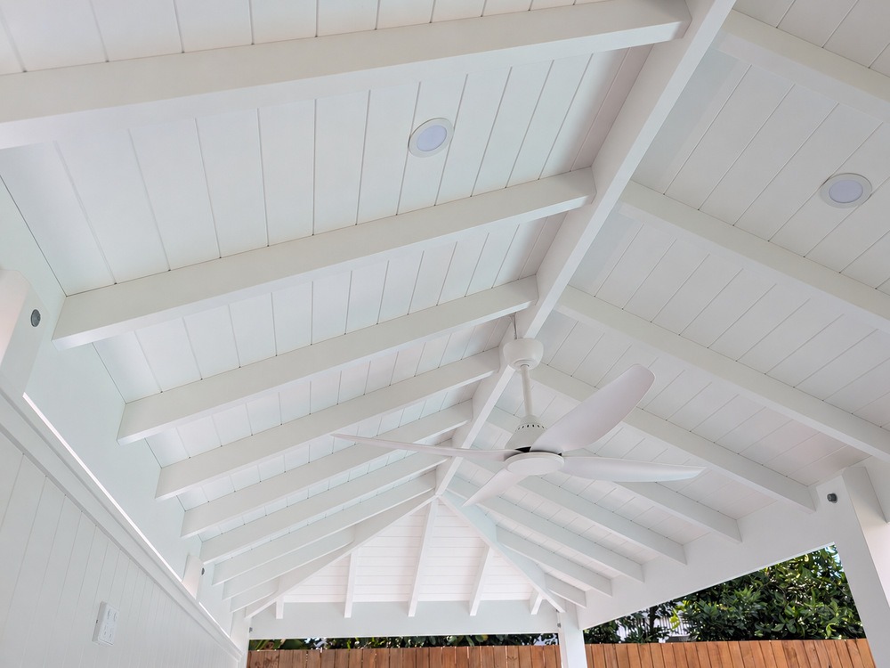 White pitched VJ-lined ceiling with exposed painted timber rafters in the Hip Roof Pool Cabana.