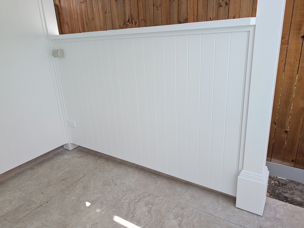 Interior corner of the Cabana showing white VJ rear and half side walls beside a Decorative Post Box.