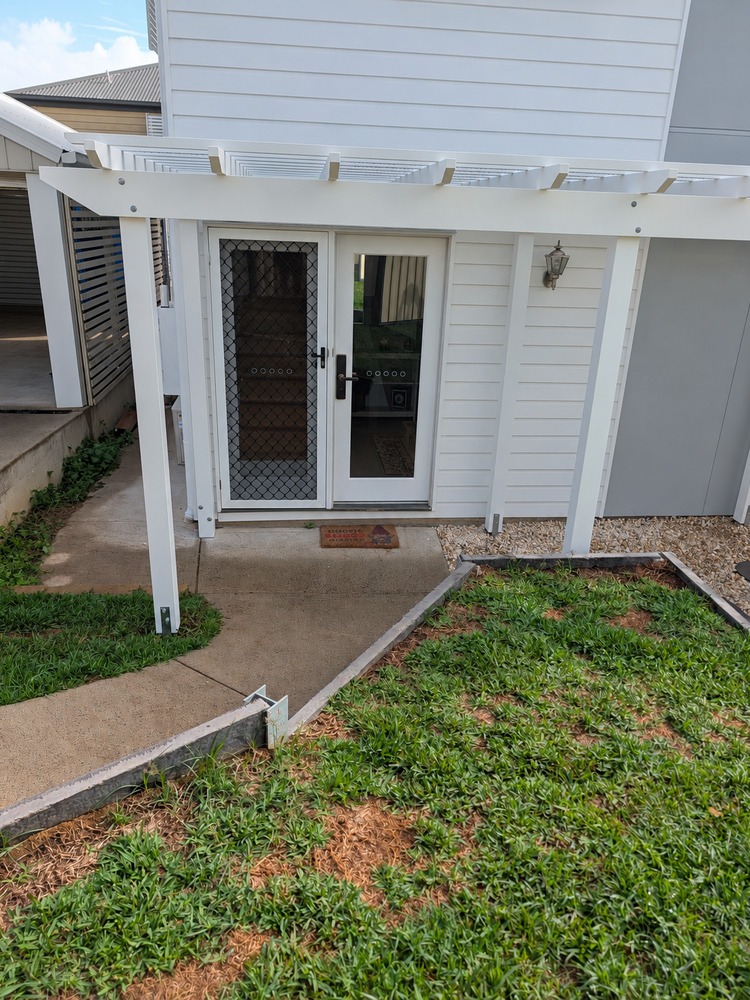 White Traditional Pergola framing the front door entrance.